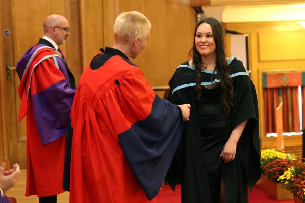 Graduates receiving their award